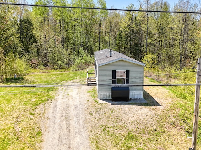 54 Whitten Rd, Clinton, ME 04927 - view of outdoor structure with a wooded view