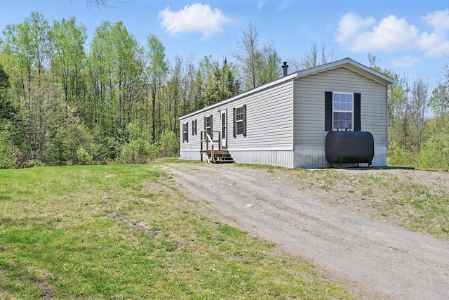 54 Whitten Rd, Clinton, ME 04927 - view of front of home with oil tank and a front yard