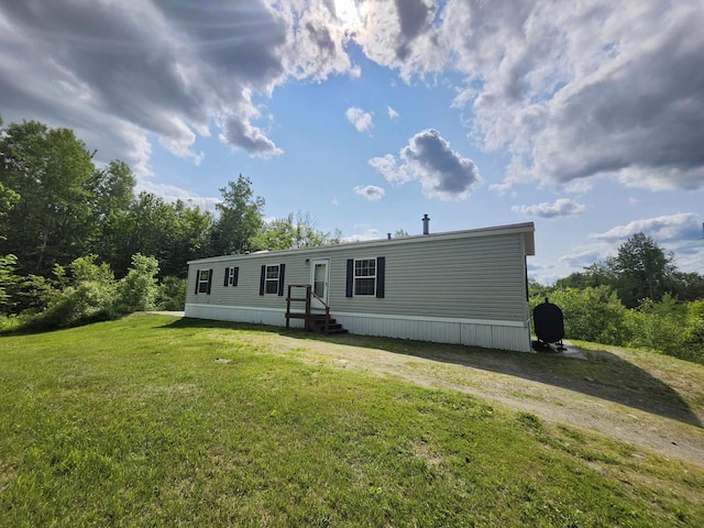 54 Whitten Rd, Clinton, ME 04927 - back of property with a yard and entry steps