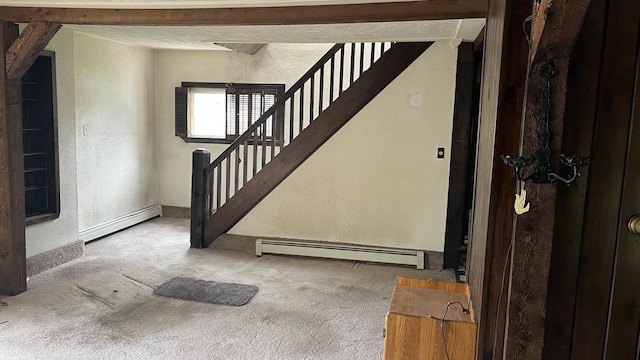 706 Crescent Ave, Rumford, ME 04276 - stairway featuring baseboard heating, a textured wall, and carpet floors