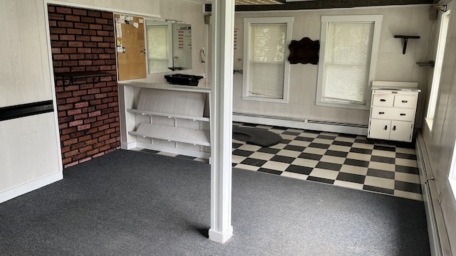 706 Crescent Ave, Rumford, ME 04276 - below grade area featuring a baseboard radiator, tile patterned floors, and wood walls