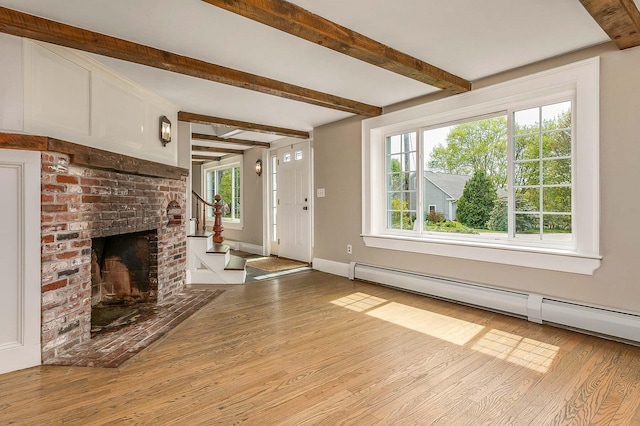 456 Ferry Rd, Saco, ME 04072 - unfurnished living room featuring a baseboard radiator, wood finished floors, beam ceiling, a fireplace, and baseboards