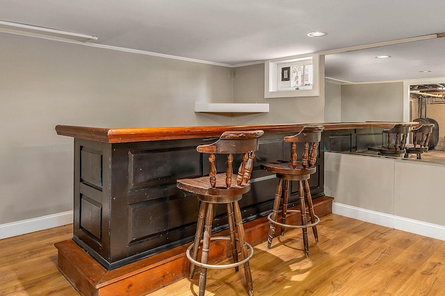 456 Ferry Rd, Saco, ME 04072 - indoor bar with wood finished floors, ornamental molding, recessed lighting, and baseboards