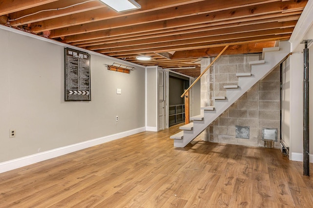456 Ferry Rd, Saco, ME 04072 - finished below grade area with stairway, wood finished floors, and baseboards
