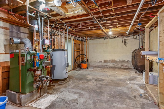456 Ferry Rd, Saco, ME 04072 - unfinished basement with electric water heater, heating fuel, and a heating unit