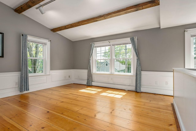 456 Ferry Rd, Saco, ME 04072 - spare room featuring light wood-type flooring, a wainscoted wall, and a baseboard radiator