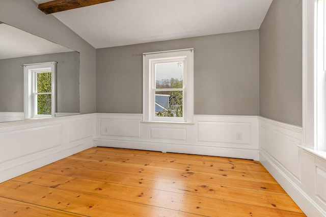 456 Ferry Rd, Saco, ME 04072 - empty room featuring a wainscoted wall and light wood finished floors