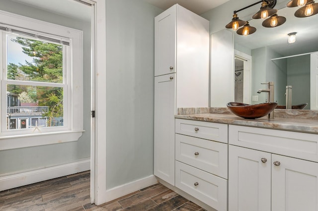 456 Ferry Rd, Saco, ME 04072 - bathroom featuring wood finished floors, vanity, and baseboards