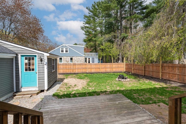 456 Ferry Rd, Saco, ME 04072 - view of yard featuring an outdoor fire pit, a wooden deck, and an outbuilding