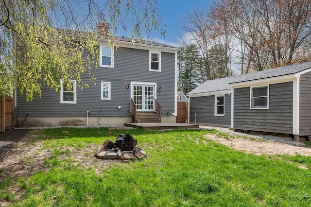 456 Ferry Rd, Saco, ME 04072 - back of property featuring entry steps, a fire pit, and a chimney