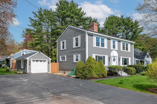 456 Ferry Rd, Saco, ME 04072 - colonial home featuring a chimney, an outbuilding, a garage, and driveway