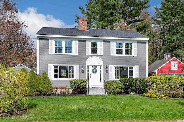 456 Ferry Rd, Saco, ME 04072 - colonial inspired home with a chimney and a front yard