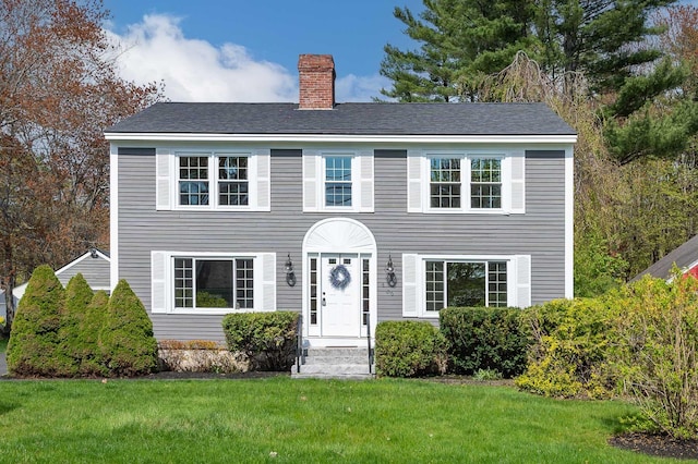 456 Ferry Rd, Saco, ME 04072 - colonial home with a chimney and a front lawn