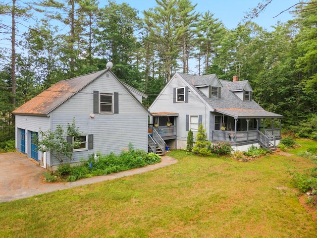 184 Long St, Limerick, ME 04048 - view of front of home featuring a sunroom, a front yard, stairs, a chimney, and roof with shingles