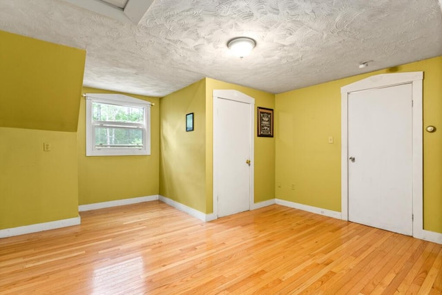 184 Long St, Limerick, ME 04048 - unfurnished room with light wood-type flooring and a textured ceiling
