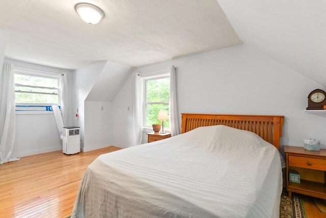 184 Long St, Limerick, ME 04048 - bedroom with lofted ceiling, light wood finished floors, and multiple windows