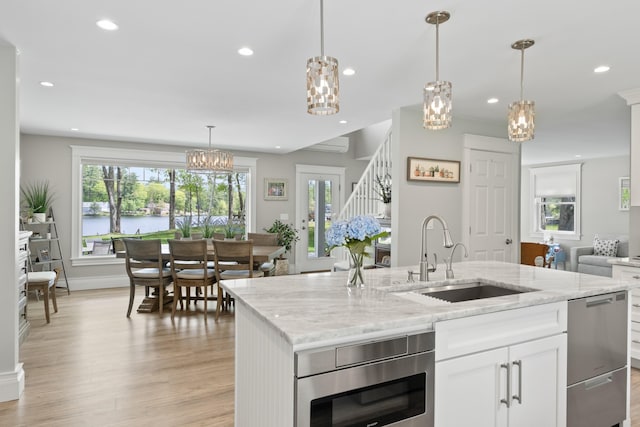 7 Passby Point Rd, Windham, ME 04062 - kitchen featuring a sink, dishwasher, light wood finished floors, open floor plan, and recessed lighting