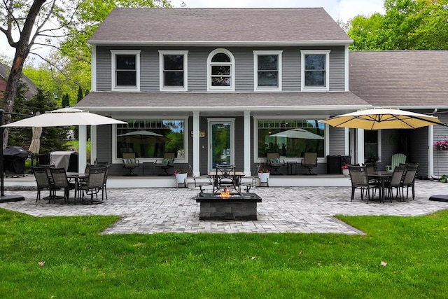 7 Passby Point Rd, Windham, ME 04062 - back of property featuring a fire pit, a yard, and a patio