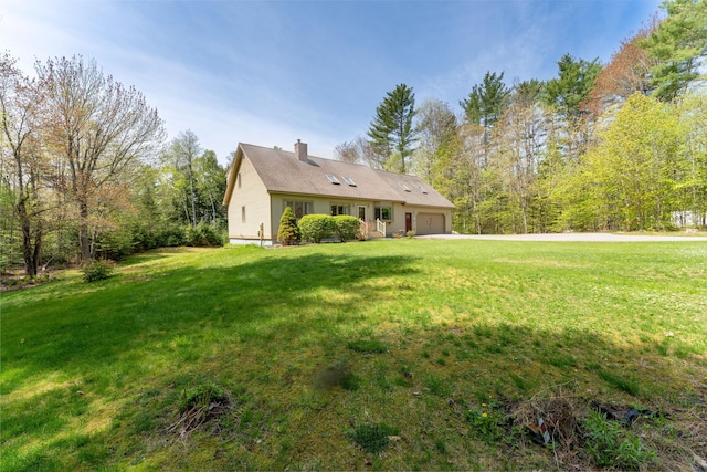 738 Litchfield Rd, Bowdoin, ME 04287 - view of front of house featuring an attached garage, a front lawn, and a chimney