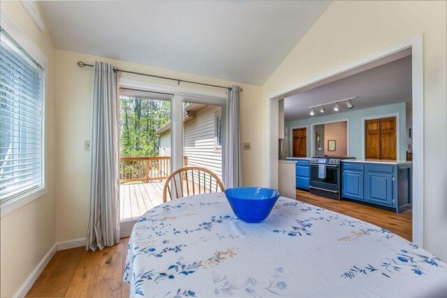 738 Litchfield Rd, Bowdoin, ME 04287 - dining space featuring lofted ceiling, light wood-type flooring, and baseboards
