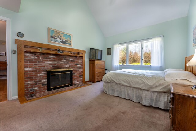 738 Litchfield Rd, Bowdoin, ME 04287 - bedroom with carpet floors, a brick fireplace, and high vaulted ceiling