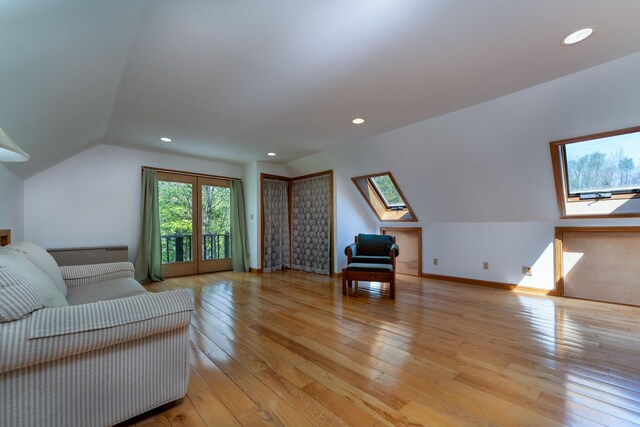 738 Litchfield Rd, Bowdoin, ME 04287 - living room with light wood finished floors, a skylight, baseboards, recessed lighting, and lofted ceiling