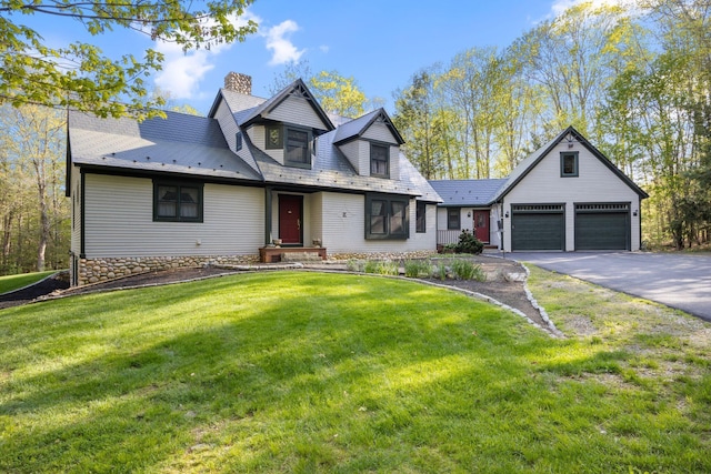 356 Brixham Rd, Eliot, ME 03903 - view of front of home featuring a chimney, asphalt driveway, a front lawn, and an attached garage