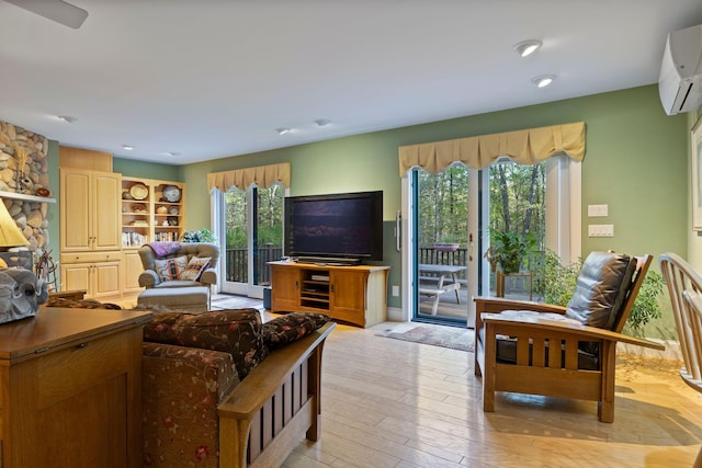 356 Brixham Rd, Eliot, ME 03903 - living room featuring a wall unit AC, light wood-style floors, and recessed lighting