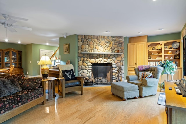 356 Brixham Rd, Eliot, ME 03903 - living room with a ceiling fan, light wood-style floors, a stone fireplace, stairway, and recessed lighting