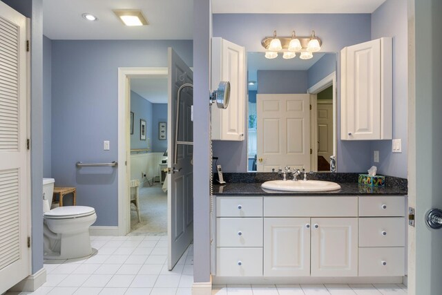 356 Brixham Rd, Eliot, ME 03903 - bathroom featuring tile patterned floors, vanity, toilet, and baseboards