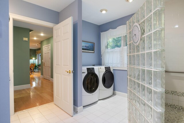 356 Brixham Rd, Eliot, ME 03903 - clothes washing area with washer and clothes dryer, tile patterned flooring, and baseboards