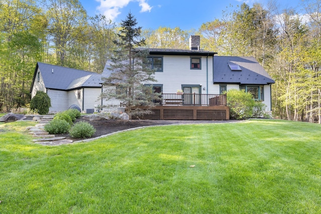356 Brixham Rd, Eliot, ME 03903 - back of property featuring a chimney, a deck, and a yard
