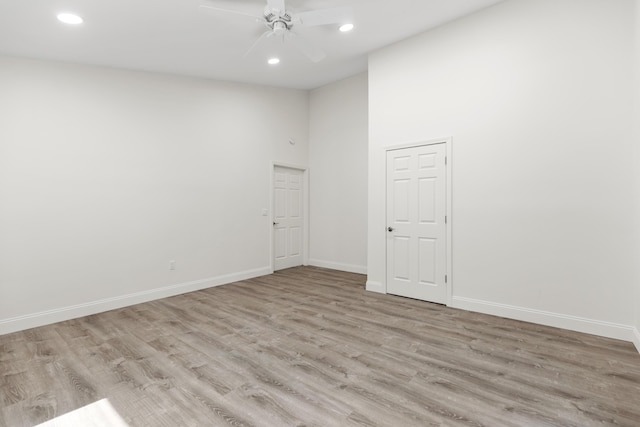5 Zakelo Island Rd, Harrison, ME 04040 - spare room with light wood-style flooring, a ceiling fan, recessed lighting, baseboards, and a towering ceiling