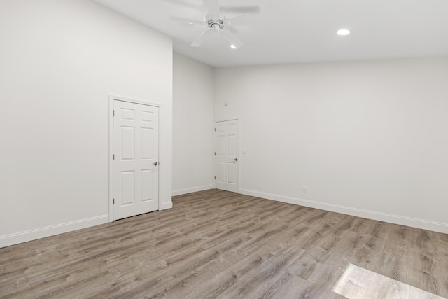 5 Zakelo Island Rd, Harrison, ME 04040 - unfurnished room with light wood-style floors, a ceiling fan, recessed lighting, baseboards, and high vaulted ceiling