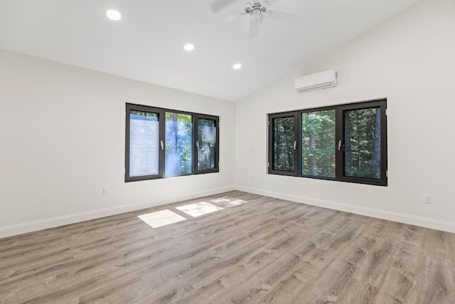 5 Zakelo Island Rd, Harrison, ME 04040 - spare room with an AC wall unit, healthy amount of natural light, recessed lighting, baseboards, and high vaulted ceiling