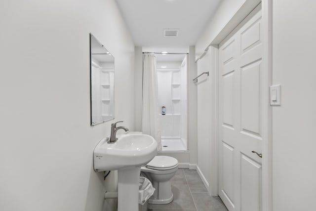 5 Zakelo Island Rd, Harrison, ME 04040 - full bathroom with curtained shower, tile patterned flooring, toilet, and baseboards