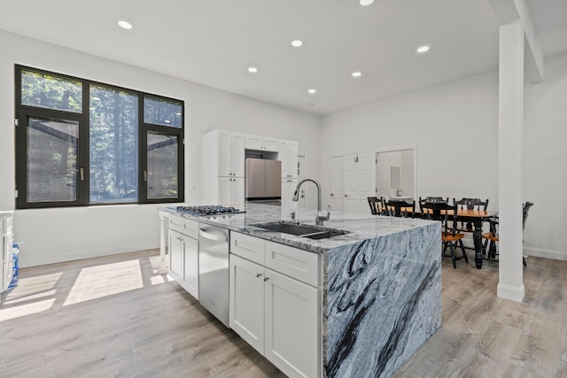 5 Zakelo Island Rd, Harrison, ME 04040 - kitchen featuring a sink, stainless steel appliances, white cabinetry, light stone countertops, and recessed lighting