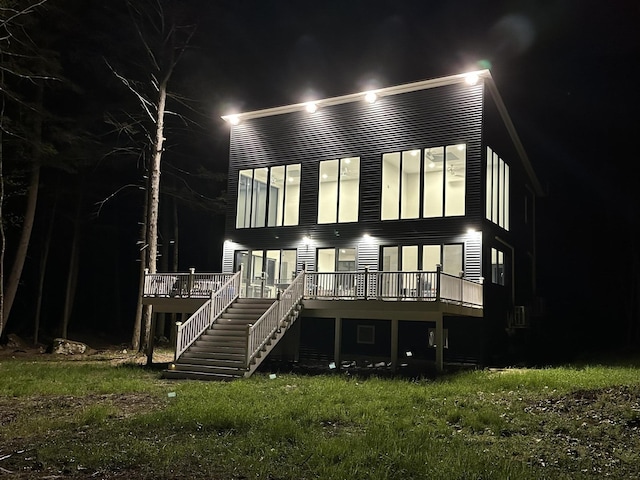 5 Zakelo Island Rd, Harrison, ME 04040 - back of house at twilight featuring a wooden deck and stairway