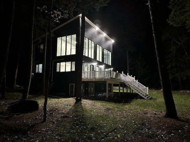 5 Zakelo Island Rd, Harrison, ME 04040 - back of house at twilight with stairway and a wooden deck