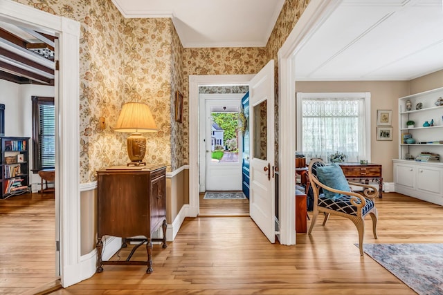 30 Morrill Ave, Waterville, ME 04901 - foyer with light wood finished floors, ornamental molding, wallpapered walls, and wainscoting