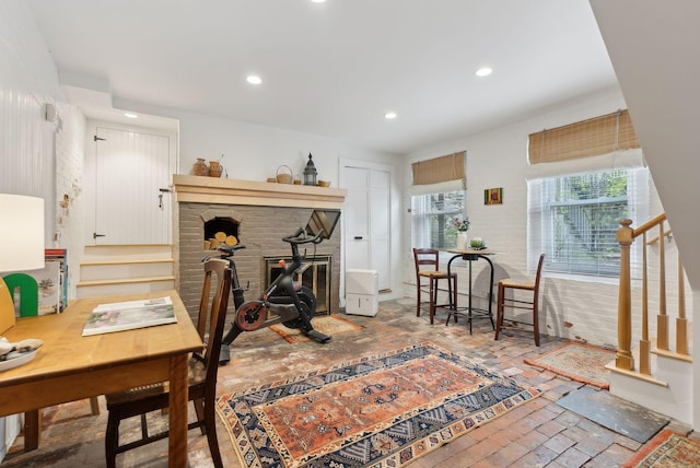 377 Cumberland Ave, Portland, ME 04101 - living area with stairs, recessed lighting, and a brick fireplace