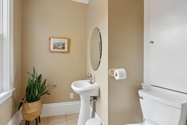 377 Cumberland Ave, Portland, ME 04101 - half bath with toilet and tile patterned flooring