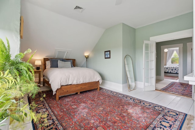 377 Cumberland Ave, Portland, ME 04101 - bedroom featuring baseboards and vaulted ceiling