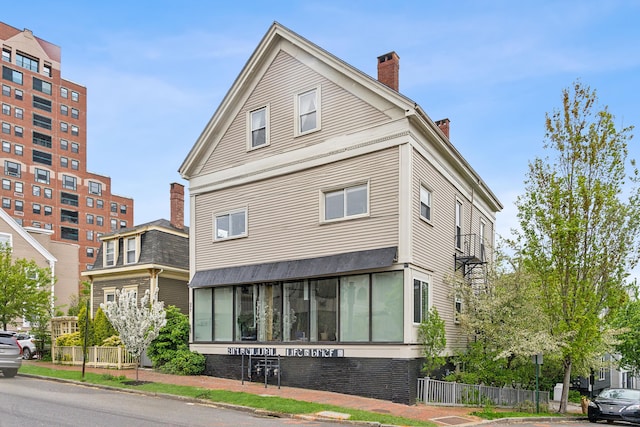 377 Cumberland Ave, Portland, ME 04101 - view of front of property with a chimney