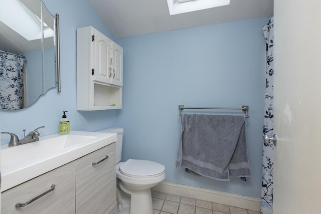 6 Linwood Rd Unit 6, Freeport, ME 04032 - full bathroom with a skylight, vanity, toilet, tile patterned flooring, and baseboards