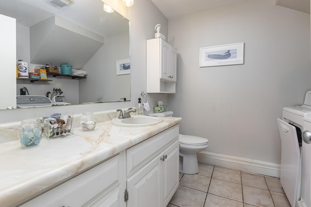 6 Linwood Rd Unit 6, Freeport, ME 04032 - bathroom with toilet, vanity, lofted ceiling, baseboards, and tile patterned flooring