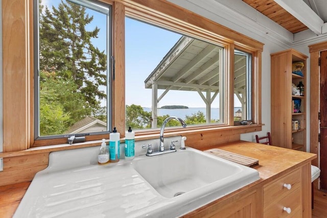 13 Bustins Is, Freeport, ME 04032 - kitchen featuring a water view, beam ceiling, a sink, and wood finished floors