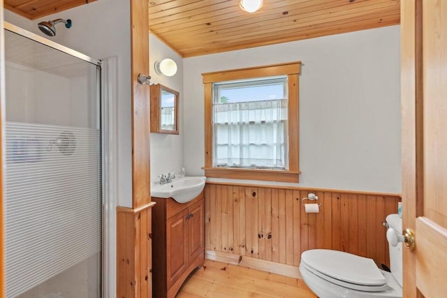 13 Bustins Is, Freeport, ME 04032 - bathroom featuring a shower stall, wainscoting, toilet, vanity, and wood finished floors
