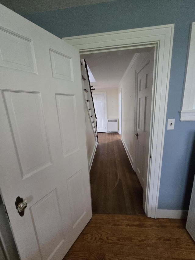 22 Summer St, Lubec, ME 04652 - corridor featuring dark wood-style floors, baseboards, and radiator