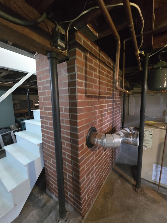 22 Summer St, Lubec, ME 04652 - basement featuring stairs and brick wall